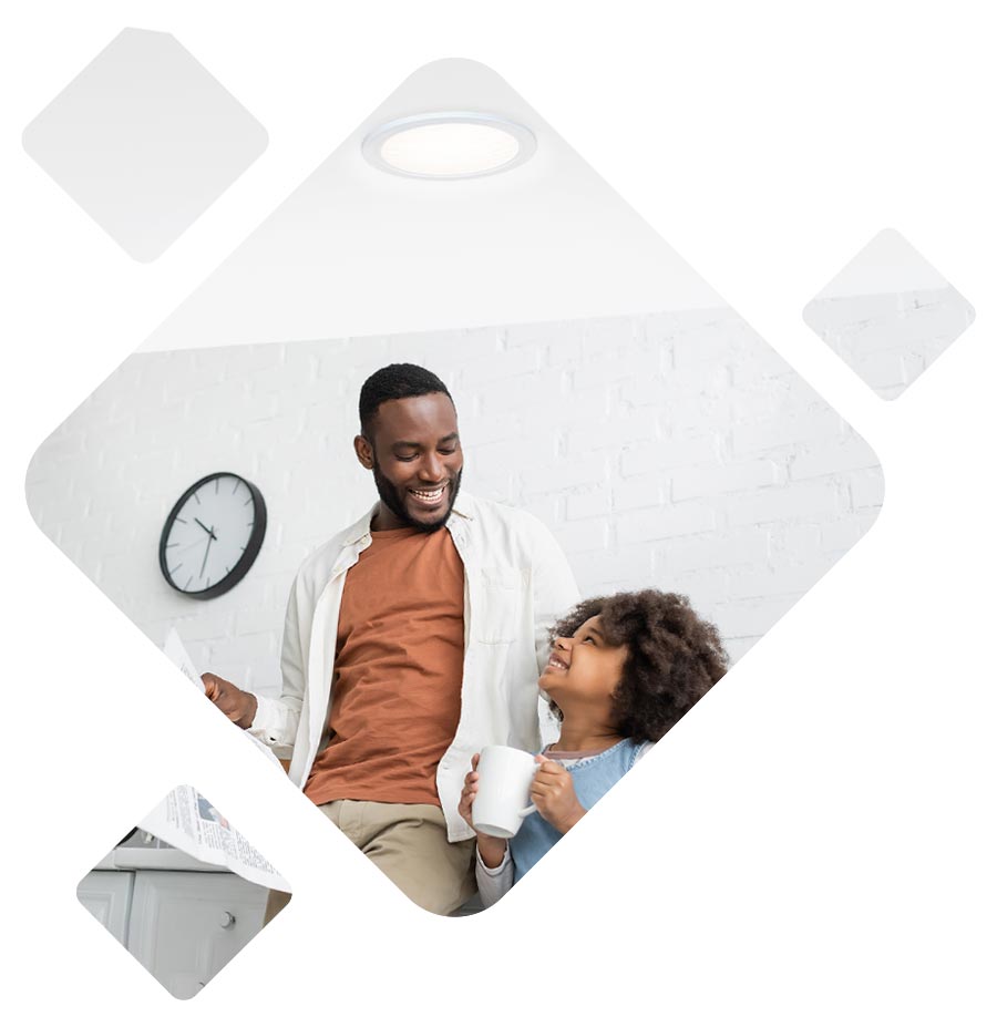 dad daughter in kitchen under tubular skylight