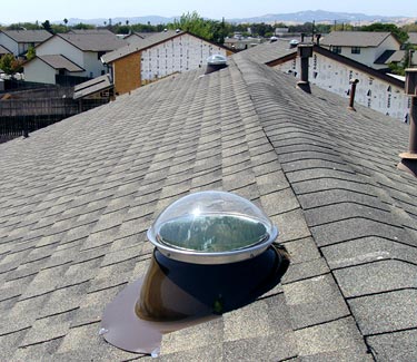 NLES bronze pitched roof tubular skylight installed thumb