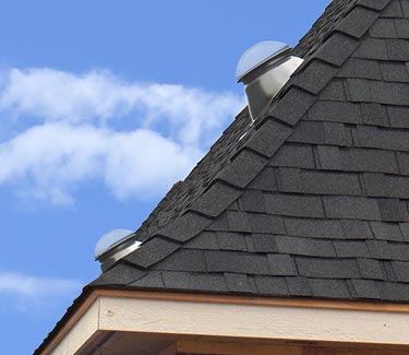 Two Natural Light tubular skylights installed on steep pitched roof thumb