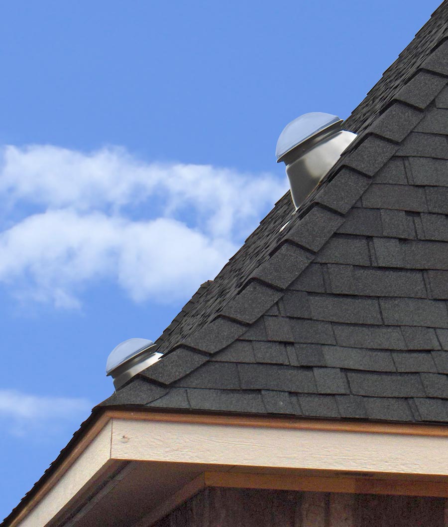 Two Natural Light tubular skylights installed on steep pitched roof