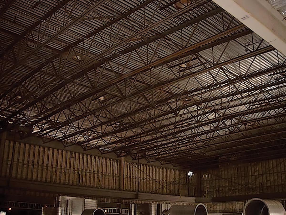 warehouse before Natural Light tubular skylights installed